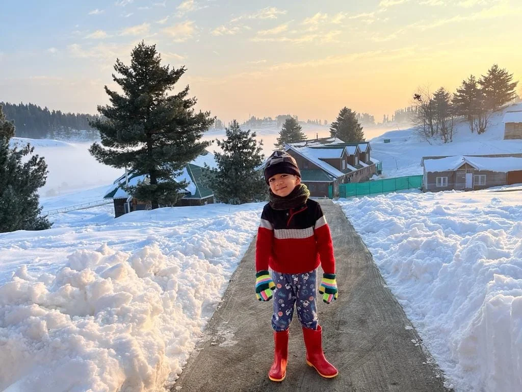 Aayaan on snow path at sunset